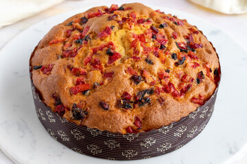 Fruit cake on a white wooden background