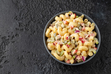 Macaroni Salad with red bell pepper, onion, celery, gherkins and mayonnaise dressing