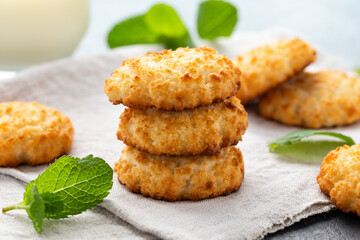 Coconut macaroons cookies served with glass of milk. Gluten free