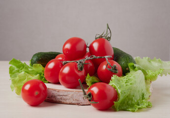 Full bowl of low calories salad with tomato, pepper, cucumber lies on scratched dark concrete. Vegetarian, dieting, healthy food. Close-up