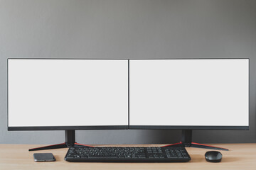 Front view of a double blank white display.There is a mobile phone, mouse, keyboard, devices for working during the coronavirus..Work from home concept - obrazy, fototapety, plakaty