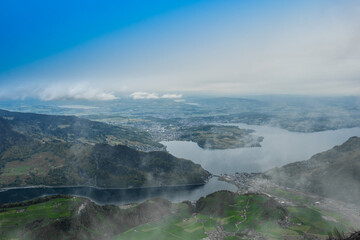 Landscape panoramic view of the valley of Stans, with a lake in the background, shot in Stanserhorn, Nidwald, Switzerland