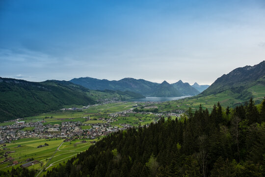 Landscape panoramic view of the valley of Stans, with a lake in the background, shot in Stanserhorn, Nidwald, Switzerland