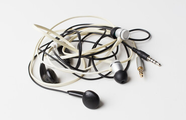 messy wire earphone Twisted on white background