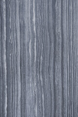 dark surface with black and white grooves like the lines of the bark of a tree trunk - decorative texture for the background of a tile