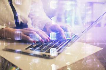 Multi exposure of woman hands working on computer and data theme hologram drawing. Tech concept.