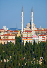 Fototapeta na wymiar The view of Bademlik mosque on the top of hill in Sutluce neighborhood of Istanbul
