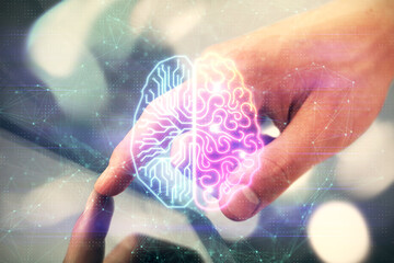 Double exposure of man's hand holding and using a digital device and brain hologram drawing. Data concept.