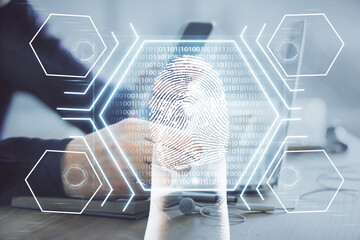 Double exposure of man's hands holding and using a digital device and fingerprint hologram drawing. Security concept.