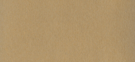 Clean brown cardboard paper background texture. Horizontal banner