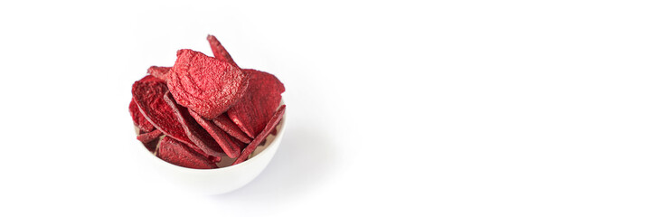 Obraz premium Crispy dried food. Organic tasty chips. Homemade snacks. Sliced beetfood. Healthy vegetables. Trend natural slice. Horizontal banner. Copyspace