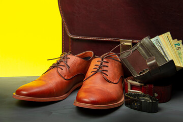 Collection of men's accessories. Men's shoes, belt, watch, wallet with money and briefcase. Mens accessories background.