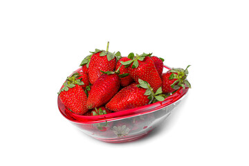 Ripe, fresh strawberries in a glass vase on a white isolated background.