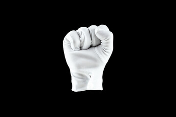 Human hand, hand in a white glove isolated on a black background, shows a fist gesture. Human...