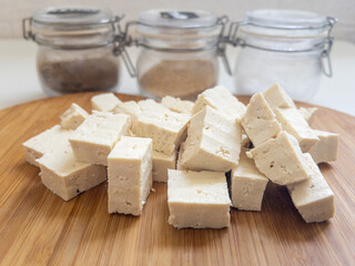 Tofu cheese on bamboo chopping board
