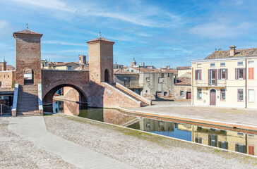 Fototapeta premium Comacchio, Italy - often compared to Venice for the canals and the architecture, Comacchio displays one of the most characteristic old towns in Emilia Romagna