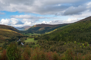 Fototapeta na wymiar Autumn landscape with river Abhainn Droma in Scotland.