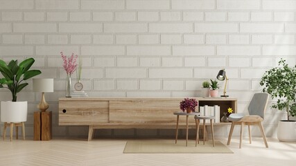 Cabinet for tv in living room with brick wall.