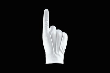Brush, Hand in a white glove isolated on a black background, shows the index finger. Concept human gesture direction, idea, attention, one.