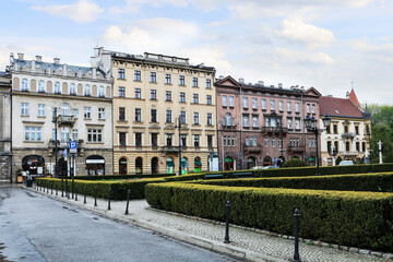 Obraz premium KRAKOW, POLAND - MAY 05, 2021: Old town street with ancient tenements and other monuments