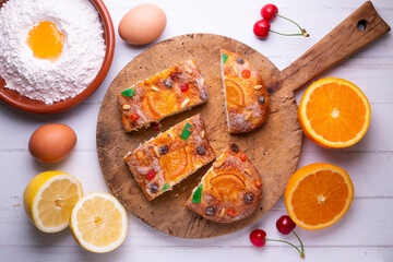 Coca de sant joan. Traditional San Juan cake to celebrate the arrival of summer in Spain made with brioche bread, candied fruit and nuts.