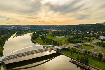 Aerial view of Prague. Troja Bridge over the river Vltava and Prague Zoo in background. White arch in Holesovice. Czech: 