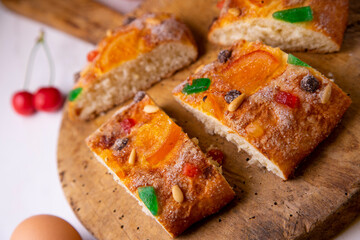 Coca de sant joan. Traditional San Juan cake to celebrate the arrival of summer in Spain made with brioche bread, candied fruit and nuts.