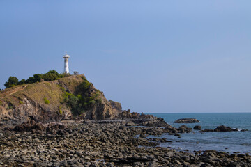 Fototapeta na wymiar lighthouse on cliff. landmark of Koh Lanta, Krabi, Thailand.