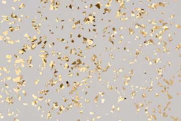 Golden confetti on grey background, party gold foil glitter backdrop.