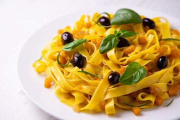 Fresh pasta with olives and pumpkin