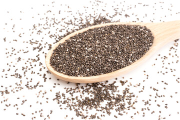 Big wooden spoon with chia seeds on a white table