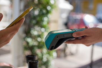 Close up shot of contactless payment taking place