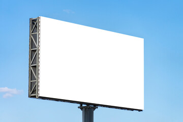 Fototapeta premium Blank big billboard against blue sky background. White horizontal board mock up for advertising, marketing, information