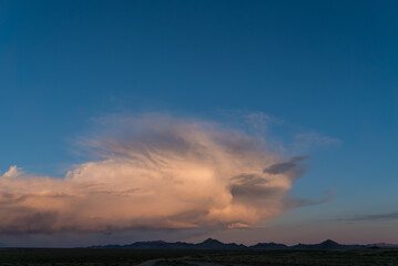 sunset mountain landscape in mongolia, pink unusual cloud