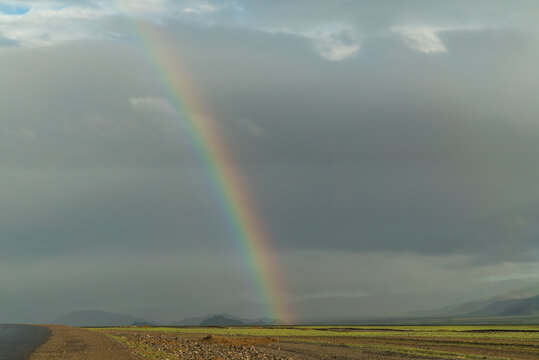 the beginning of a rainbow on a beautiful mountain sunny landscape © Jonny