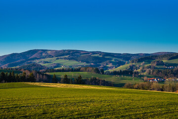 Fototapeta na wymiar Germany, Schwarzwald panoramic view nature landscape of green fruitful meadows and endless forest in warm sunset atmosphere near st peter