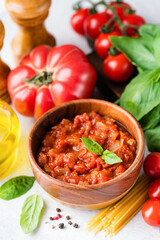 Tomato sauce marinara and ingredients for spaghetti pasta. Italian cuisine food