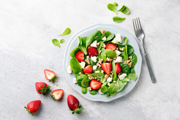 Healthy summer salad with strawberries and white cheese. Dieting, weight loss concept