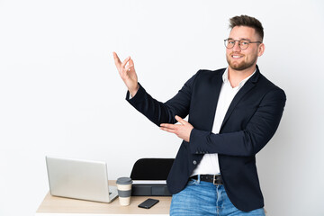 Russian man in a office isolated on white background extending hands to the side for inviting to come