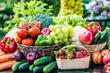 Zelfklevend Fotobehang Variety of fresh organic vegetables and fruits in the garden © monticellllo