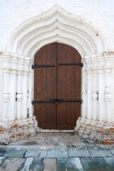 Closed antique wooden door in a temple