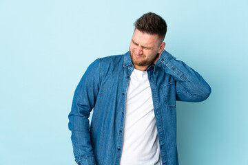Russian handsome man isolated on blue background with neckache