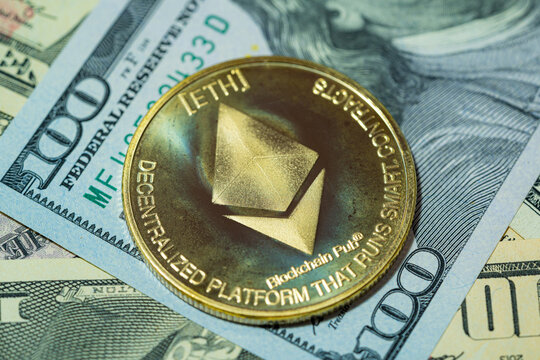 Ethereum ETH included with Cryptocurrency coin on stack 100 hundred new US dollar background it Money American Virtual blockchain technology future is money concept Close up and Macro photography.