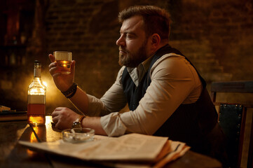 Businessman smokes cigarette and drinks alcohol