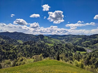 Fototapeta premium View in the Zurich Oberland of the surrounding hills in this beautiful spring season. foresight in the mountains. Steg