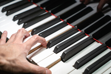 Obraz premium Piano keys on classical grand piano - closeup of piano keyboard for pianist, concert, music production and recording concept