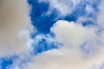 Fototapeta na wymiar Cumulus clouds on blue sky, background of white clouds on the sky