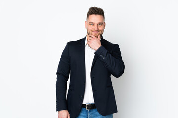 Young Russian business man isolated on white background laughing