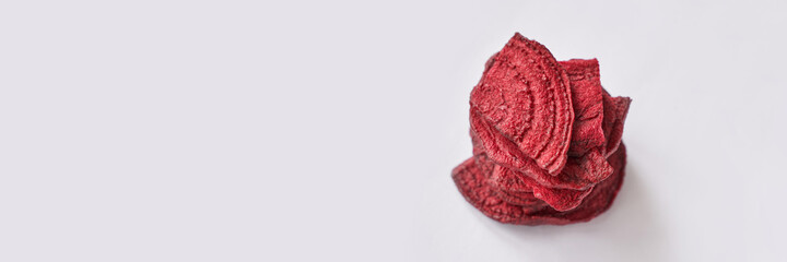 Crispy dried food. Organic tasty chips. Homemade snacks. Sliced beetfood. Healthy vegetables. Trend natural slice. Horizontal banner. Copyspace