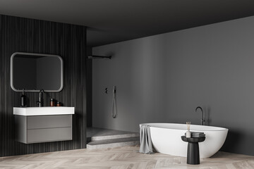 Fototapeta na wymiar Bathtub and sink with mirror in dark bathroom interior with shower